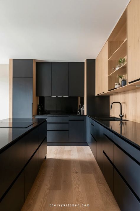 Modern kitchen with black and wood cabinetry, featuring a sleek, minimalist design. Aesthetic Black Kitchen, Black Kitchen Design Ideas, Luxury Black Kitchen, Black Lower Cabinets, Black Kitchen Inspiration, Ivy Kitchen, Black Kitchen Ideas, White Upper Cabinets, Black Kitchen Design