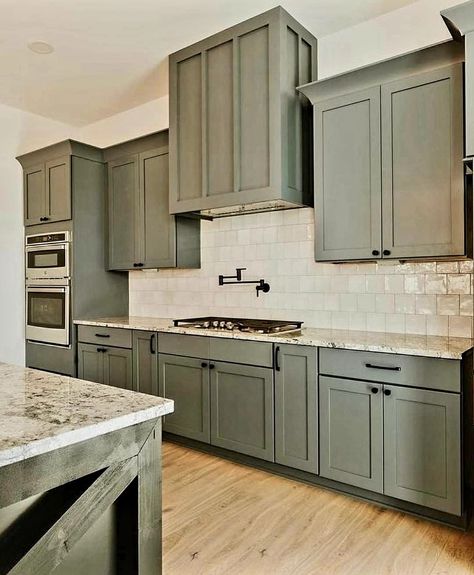 Sage Green Cabnits Kitchen, Army Green Cabinets Kitchen, Gray And Green Kitchen Ideas, Modern Farmhouse Kitchens Green Cabinets, Green Cabinets Grey Countertops, Olive Green Kitchen Ideas, Green Kitchen Cabinets Black Hardware, Kitchen Remodel Green Cabinets, Colored Kitchen Ideas