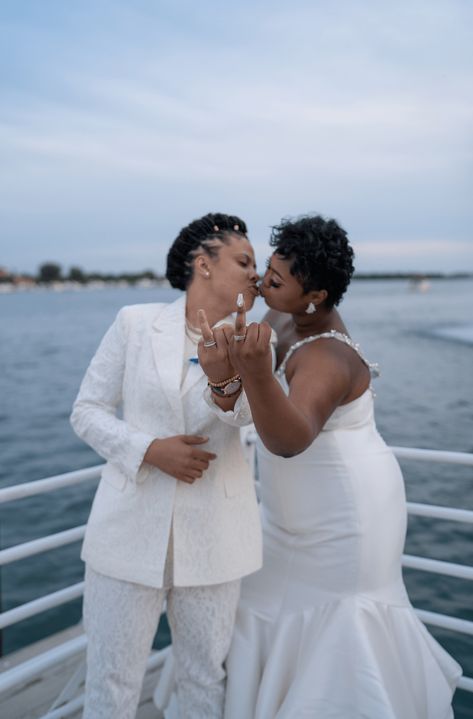 An elegant wedding celebrating Black lesbian love | Photography by Lesbian Wedding Outfits, Sparkly Outfit, Queer Weddings, Two Brides, Offbeat Bride, Candid Wedding Photos, White Suit, Waterfront Wedding, Lgbtq Wedding