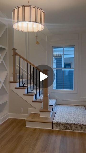 Cindy Alberding on Instagram: "In love with this landing 💕 This custom geometric bookcase is its own form of artwork to lead your eye upstairs. I imagine it filled with colorful books that can catch your eye to choose from as you wander up to bed for the evening. Designer: @cindyalberding Lighting: @visualcomfort #bookstagram #bookshelf #library #books #booklover #custom #millwork #carpentry #woodwork #staircase #upstairs #wander #house #homelibraryinspiration #home #design #homedesign #read #carpet #dreamhome" Bookshelf Library, Colorful Books, Geometric Bookcase, Custom Millwork, Library Books, Carpentry, Bookshelves, Book Lovers, Bookcase