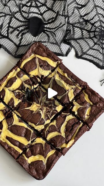 Ashley Lamego ♥ on Instagram: "Spider Web Brownies ✨

2 large eggs 
1/2 cup of butter (melted and cooled) 
3/4 -1 cup of sugar 
1 tsp of vanilla 
1/4 tsp of baking soda 
1/2 cup of all purpose flour 
1/2 cup of unsweetened cocoa powder 
1 cup of chocolate chips 

Cream Cheese Filling: 
1 cup of cream cheese (room temperature)
1 egg yolk 
1 tbsp of flour
3 tbsp of sugqr 

Preheat oven to 350 F 
In a large bowl whisk together butter, sugqr, and vanilla. 
Whisk in egg. 
In a separate bowl combine dry ingredients and slowly add to the wet. 
Fold in the chocolate chips. 
In a separate bowl combine cream cheese, sugar and flour. Mix until smooth and then add in egg yolk. 
Transfer to a piping bag/ a ziplock bag cutting a small hole in the corner of the bag. 
Pour brownie mixture into a greased 9 Spider Web Brownies, Unsweetened Cocoa Powder, Piping Bag, Ziplock Bag, All Purpose Flour, Cream Cheese Filling, Egg Yolk, Unsweetened Cocoa, 1 Egg