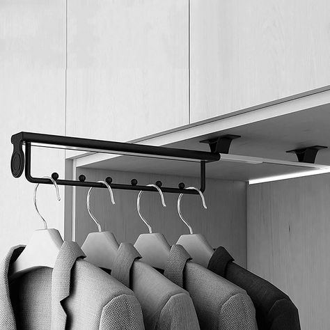 [PaidAd] The TEMKIN Extendable Clothes Rail is a versatile and practical solution for organizing your wardrobe. It can be easily mounted on the ceiling of your cupboard or wardrobe, providing additional storage space for your clothes. The rail is adjustable, allowing you to customize its length to fit your specific needs. With 8 hooks, it is perfect for hanging items such as shirts, pants, scarves, and belts. This wardrobe organization tool is not only functional but also aesthetically pleasing, as its #wardrobeorganisation Dressing Room Rails, Hanging Clothes Rail Cabinets, Pull Down Wardrobe Rail, Clothes Rail Bedroom Small Spaces, Organisation Wardrobe, Ceiling Hung Clothes Rail, Airing Cupboard, Wardrobe Organization, Beads Clothes