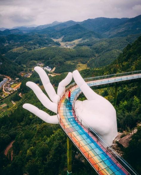 A 99-meter-long bridge supported by a huge "Buddha's hand", . constructed above cliffs and located at an altitude of 1,000 meters in Guxi's Star River scenic spot, has become a top tourist destination in Youxi county, Fujian province, providing amazing sightseeing experiences as well as breathtaking scenery for photography. . . Follou us @tourismera ✅ . for a new beautiful sights every day 🌄🏝🏞 . 📸 credit @chinadestinations Fujian China, Unique Canvas, China Travel, Digital Portrait, Travel And Leisure, Asia Travel, Beautiful Destinations, Pool Float, Places To Go