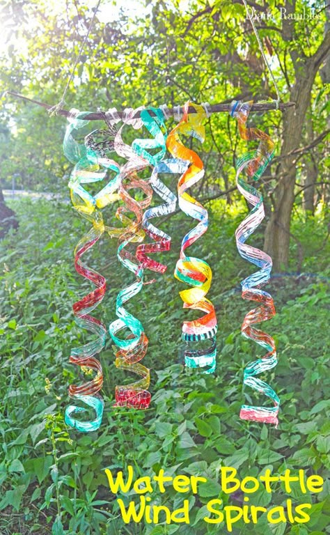 Water Bottle Wind Spiral Craft Tutorial Camping or Outdoor Craft - Here's an easy outdoor craft made with recycled plastic bottles that's perfect for all ages. These Water Bottle Wind Spirals are pretty to hang in the sun. #camping #outdoor #craft Reuse Water Bottles, Water Bottle Crafts, Plastic Bottle Art, Summer Camp Crafts, Bottle Craft, Outdoor Crafts, Kid Craft, Plastic Bottle Crafts, Recycled Art