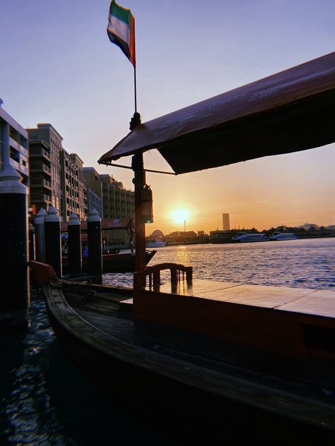 Boat ferry beautiful sunset flag blue waters buildings in the back Gold Souk Dubai, Work Vision Board, Gold Souk, Airplane Window View, Bur Dubai, Airplane Window, Boat Ride, Travel Spots, Window View