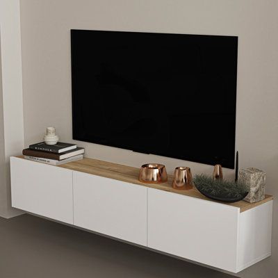 Introducing the Atelier Mobili Floating TV Console, a perfect solution for living room or bedroom TV stands. This floating media console is not only a functional piece but also a stylish addition to your home decor. It offers a modern, sleek, and space-saving design that will free up your floor space, making your room look bigger and more elegant. This floating console not only serves as a TV table but can also be used as a wall shelf, making it a versatile piece for your home. The under-TV floa Floating Cabinet Under Tv, Table Under Tv Decor, Under Mounted Tv Ideas, Shelf Under Tv On Wall, Under Tv Decor, Shelf Under Tv, Wall Mount Tv Shelf, Floating Media Console, Floating Console