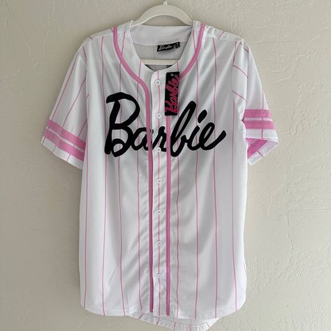 Viral, Tik Tok Famous, Official Licensed Barbie The Movie Signature Baseball Jersey - Brand New! Hard To Find, But Oh So Worth It When You Do. Make Your Loved One's Day With This Great Gift. Details: . Brand - Barbie Mattel . Size - Medium . Color - Pink, White, Black . Closure - Button Down . Style - Baseball Jersey, Number 59 On Back . Material - 100% Polyester . Machine Wash Cold, Delicate Cycle Approximate Measurements: . Pit To Pit - 22" . Shoulder To Hem Length - 29" All Measurements Are A Oversized Baseball Jersey, Cropped Baseball Jersey, Barbie Crop Top, Baseball Jersey Women, Jersey Pink, Barbie Top, Barbie Logo, Barbie Mattel, Black Barbie