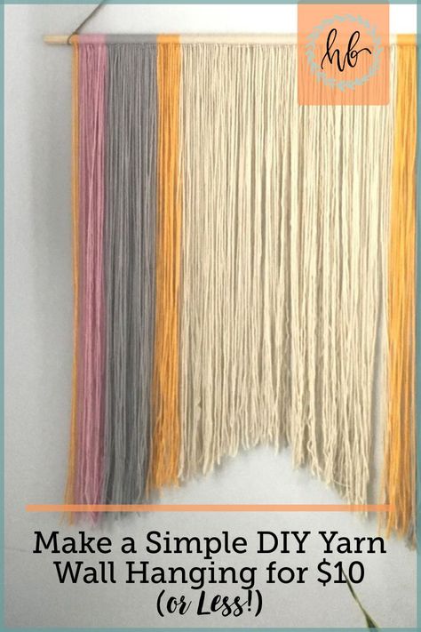 Make a simple wall yarn hanging for less than $10! | DIY Yarn Wall Hanging Tutorial | That Homebird Life Blog | #craft #craftideas #EverydayArtsandCrafts Diy Hanging Yarn Wall Art, Boho Yarn Wall Hanging Diy Easy, Wall Yarn Hanging, Yarn Tapestry Diy, Diy Wall Yarn Hanging, Yarn Hanging Diy, How To Make Yarn Wall Hanging, Simple Macrame Wall Hanging Diy, Brewery Decorations