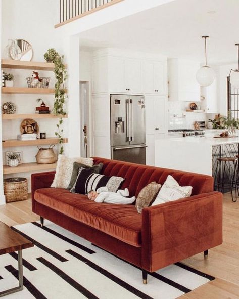 a neutral boho living room with a terracotta sofa, built in shelves, potted greenery and bright pillows plus a graphic rug Mid Century Boho Living Room, Diy Home Decor For Apartments, Industrial Interior Style, Furnitur Ruang Keluarga, Interior Design Per La Casa, Bohemian House, Living Room Red, Diy Interior, Trendy Home