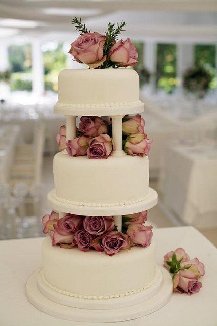 Dusty Rose Wedding Cake by The Little Village Cake Company, simply and stunning Wedding Cake With Pillars, Cake With Pillars, Cake Pillars, Dusty Rose Wedding Colors, Rose Wedding Cake, 3 Tier Wedding Cake, Dusty Pink Weddings, Popular Wedding Colors, Wedding Cake Roses