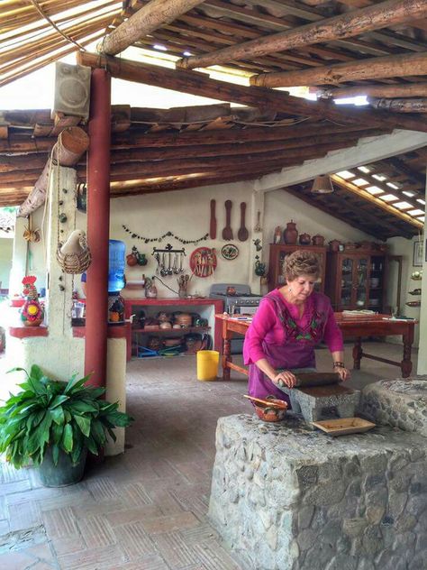 Cooking in an outdoor Mexican kitchen. Hacienda Outdoor Kitchen, Traditional Mexican Kitchen Design, Mexican Outside Kitchen Ideas, Outside Mexican Kitchen, Spanish Outdoor Kitchen Hacienda Style, Mexican Style Backyard, Outdoor Kitchen Mexican, Mexican Laundry Room, Outdoor Kitchen Mexican Style