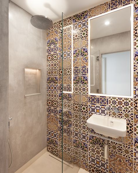 This En-Suite in of the guest bedrooms stands out for the vibrant Moroccan style tiles used along the main wall. This contrasts to the concrete effect finish on the other walls within this small space.   #bathroom #shower #tiling #interiordesign #morocco #moroccaninteriors #Moroccantiles #home #homedecor Moroccan Bathroom Ideas, Shower Tiling, Moroccan Tile Bathroom, Utility Ideas, Moroccan Bathroom, Trendy Bathroom Tiles, Riad Marrakech, Space Bathroom, Style Tiles