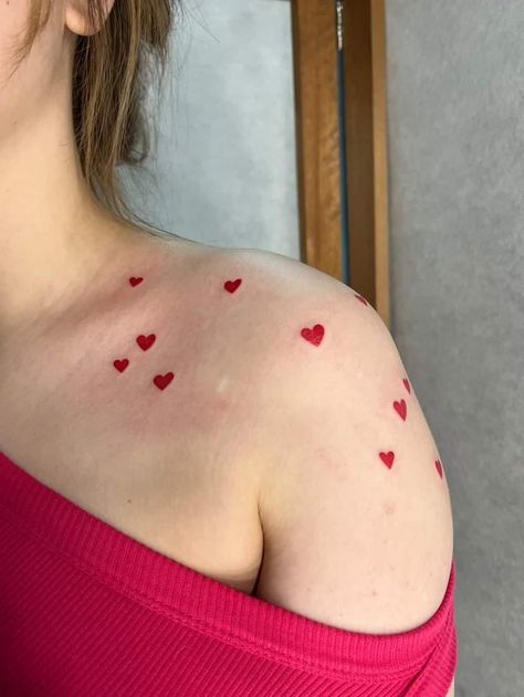 Tiny Colour Tattoo, Heart Tattoo Placement For Women, Red Tattoo Collar Bone, Red Tattoo Designs For Women, Colorful Girly Tattoos, Cute Tattoos Arm, Red Dot Tattoo, Little Red Heart Tattoo, Red Ink Tattoos On Dark Skin