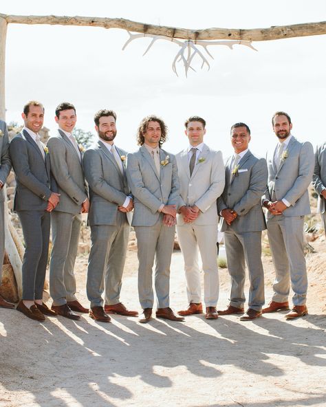 Basil's groomsmen—his two brothers, high school friends, and Ashley's sister's fiancé—looked sharp in light gray suits, neutral shirts and ties, and brown shoes. Gray Suit Groomsmen, Light Grey Groomsmen Suits, Light Gray Suits, Bohemian Reception, Neutral Shirts, Mismatched Groomsmen, California Desert Wedding, Light Gray Suit, Pastel Invitation