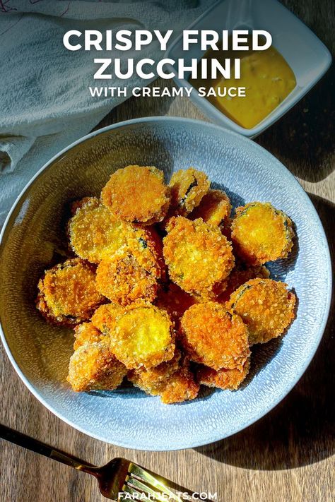 These Eggless Crispy Fried Zucchini bites are simply irresistible! An easy recipe of sliced zucchinis dipped in seasoned batter and panko, then fried until golden perfection. Serve with a delicious creamy dipping sauce that's the same as my In-N-Out copycat special sauce! Also included are air fryer instructions. This is an eggless recipe, making it vegan friendly! Eggless Zucchini Recipes, Crispy Fried Zucchini, Zucchini Vegan, Mushroom Bites, Creamy Dipping Sauce, Crispy Zucchini, Zucchini Bites, Fried Zucchini, Easy Peasy Recipes