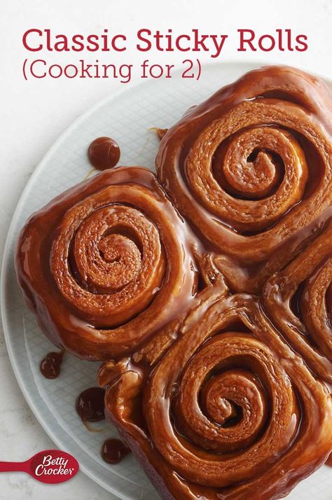 If you’ve ever woken up craving a warm, gooey sticky roll for breakfast, but just don’t want to make a huge batch, this recipe is just for you (and one other person). These made-from-scratch rolls are surprisingly simple, full of buttery caramel flavor and have just the right sticky-and-tender texture to make them an all-time-favorite recipe. Small Batch Caramel Rolls, Small Batch Sticky Buns, Easy Hot Cross Buns Recipe, Easy Hot Cross Buns, Cooking For 2, Caramel Sticky Buns, Sticky Rolls, Cross Buns Recipe, Easter Meal