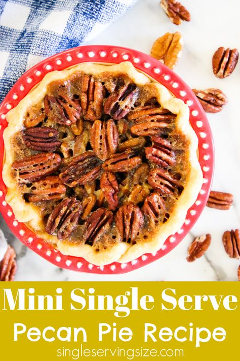 Pecan pie in a red pie plate sitting on a white marble table with scattered pecans on the table and a blue dish cloth in the background. Single Serve Pecan Pie, Pie Tarts Mini, Pie Day Recipes, Pi Day Recipes, Pie With Shortbread Crust, Individual Pecan Pies, Pecan Pie Recipe Without Corn Syrup, Mini Pecan Pie Recipes, Single Serve Dessert Recipes