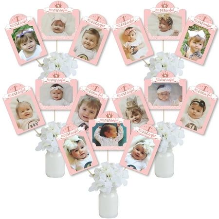 Display your favorite photos during the 1st Birthday Little Miss Onederful Girl First Birthday Party with Photo Table Toppers. Photo Table Toppers is a set of 15 heavy-duty cardstock paper photo holder pieces and 15 table topper sticks to create Girl First Birthday Party picture centerpiece sticks. Each photo holder has 4 pre-cut slits to tab your own 4x6 photo - 10 vertical photo holders and 5 horizontal photo holders. Do-it-yourself assembly is required to easily tab your own photo and then at First Birthday Table Setup, Picture Centerpieces, First Birthday Centerpieces, Little Miss Onederful, Miss Onederful, Paper Picture Frames, Diy Centerpiece, Photo Table, Pink Party Decorations