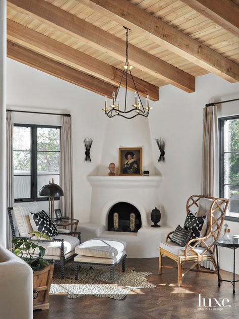 To make the spacious master bedroom feel a little cozier, Ryan enlisted Modern Group to create a wood parquet floor. On either side of the fireplace, aged iron sconces by Kelly Wearstler for Visual Comfort & Co. are almost sculpture-like. Spanish Fireplace, Wood Parquet Flooring, Farmhouse Light Fixtures, Studio Interior Design, Mediterranean Design, Colored Ceiling, Spanish Style Homes, Luxe Interiors, Interiors Design