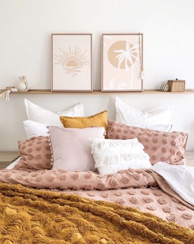 A serene and calming mustard and blush pink modern-boho bedroom.  The perfect way to layer cushions on your bed for a look that is stylish yet comfortable.  Cushions by seaTribe Australia.  #modernboho #modernbohobedroom #neutralbedroom #layeredcushions #bedcushionsaustralia Mustard Pillows Bedroom, Colourful Cushions On Bed, Bedroom Decor Mustard, Blush Pink Boho Bedding, Bedroom Cushions Ideas, Boho Mustard Bedroom, Pink And Mustard Boho Bedroom, Blush And Mustard Bedroom, Mustard Decor Bedroom