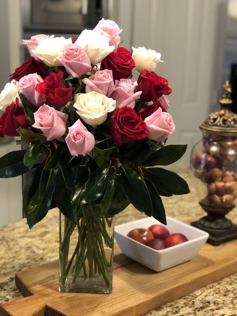 Red, white, pink roses with magnolia leaves Pink And Red Rose Arrangement, Pink Red White Flower Arrangement, Quince Centerpieces, Rose Centerpieces Wedding, White Pink Roses, Pink Centerpieces, Fresh Flower Market, White Floral Arrangements, White Flower Arrangements