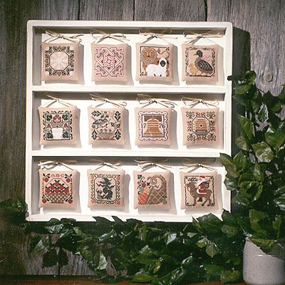 Prairie Schooler Cross Stitch, Prairie Schooler Cross Stitch Charts, Holiday Cross Stitch Patterns, Prairie Schooler, Needlework Shops, Plastic Envelopes, Needlepoint Patterns, Cardboard Paper, Bowl Fillers