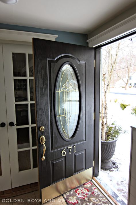 Front Door makeover with black paint and brass hardware-www.goldenboysandme.com Front Doors Painted Black, Refinish Door, Garage Door Makeover Diy, Cherry Flooring, Black Exterior Doors, Front Door Paint, Gaines Farmhouse, Black Front Door, Front Door Hardware