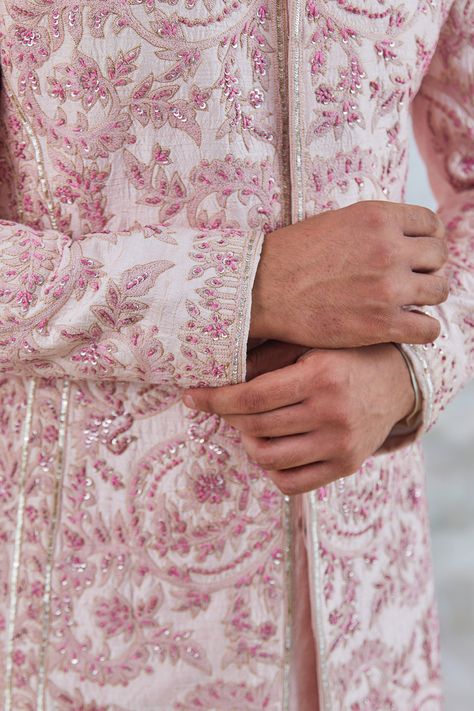 Soft pink raw silk sherwani with resham jaal all over, sequin work, and resham embroidery. Paired with plain trouser, kurta and embroidered pair of juttis. Components: 4 Pattern: Embroidered Type Of Work: Floral Neckline: Mandarin collar Sleeve Type: Full Fabric: Raw Silk Color: Pink Other Details:  Concealed placket Side slits Embroidered Juttis Occasion: Wedding - Aza Fashions Sherwani Groom Wedding Classy, Sherwani Embroidery, Sherwani Groom Wedding, Pink Sherwani, Men Sherwani, Sherwani For Men Wedding, Wedding Kurta, Wedding Kurta For Men, Wedding Outfits For Groom