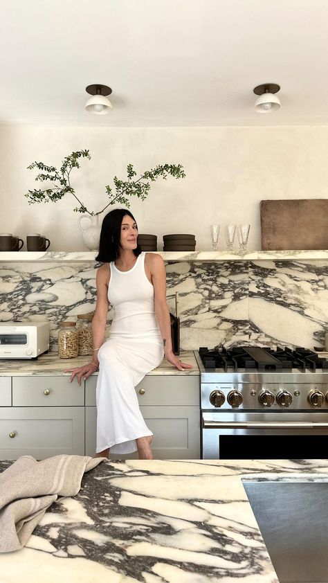 So, I saw all your questions about the difference in thickness of my marble counter and shelves in my Amagansett kitchen…and decided it was… | Instagram Kitchen With Marble Shelf, Marble Counters Kitchen, Cb2 Kitchen, Eyeswoon Kitchen, Black And White Beach House, Calacatta Monet, Manhattan Beach Homes, Marble Shelves, Kitchen Pics