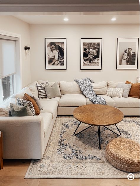 Living room decor. Round wooden coffee table, blue and white floral area rug with a light beige couch. Oversized black gallery prints. Jute floor cushion and brown, blue and green cushion covers. 

Follow my shop @thesamesstyle on the @shop.LTK app to shop this post and get my exclusive app-only content!

#liketkit #LTKunder100 #LTKstyletip #LTKhome
@shop.ltk
http://liketk.it/3qvd2 Beige Couch Living Room, Beige Living Room Decor, Beige Bank, Ruang Tv, Beige Couch, Beige Living Rooms, White Living Room, Blue Living Room, Decor Home Living Room