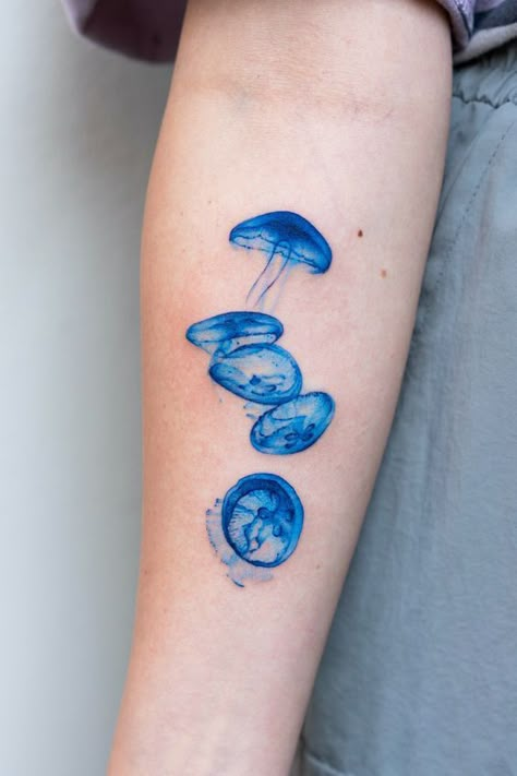 Discover the art of transformation with jellyfish tattoos in our article. Explore it and find 50+ stylish designs with meanings explained. Blue Ink Tattoos, Iphone Pic, Ray Tattoo, 16 Tattoo, Funky Tattoos, Jellyfish Tattoo, Blue Tattoo, Cute Little Tattoos, Cute Tiny Tattoos