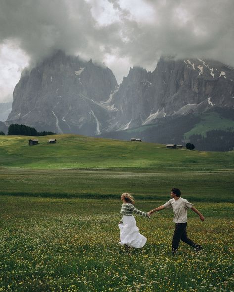 two lovers running through the meadows of the italian dolomites • • • keywords: documentary photography, cinematic photography, visual poetry, storytelling, love, couples photoshoot, tampa elopement, travel photographer, couples inspo, romcom, movie scenes, italy, dolomites, dolomites photos 🏷️ #floridaphotographer #tampaphotographer #stpeteweddingphptographer #tampaweddingphotographer #destinationweddingphotograoher #stpetephotographer #film #visualpoetry #cinematicphotographer #floridaw... Tampa Elopement, Elopement Italy, Mountains Photoshoot, Dolomites Elopement, Mountain Couple, Italian Dolomites, Photography Cinematic, Authentic Love, Dolomites Italy