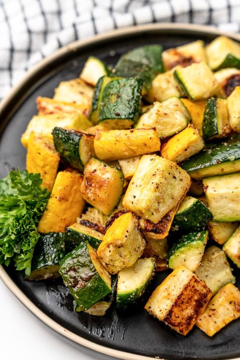 This oven roasted zucchini and squash is the perfect simple side dish. Fresh veggies tossed in olive oil, seasonings, and roasted to perfection. Squash Zucchini Onion Recipes Oven, Sauteed Zucchini And Squash Recipes, Best Way To Cook Squash And Zucchini, Asparagus And Squash Recipes, Broiled Veggies In Oven, Roasted Potatoes Zucchini And Squash, Roasted Zucchini And Potatoes, Roasted Zucchini And Yellow Squash Oven, Roasted Summer Squash And Zucchini