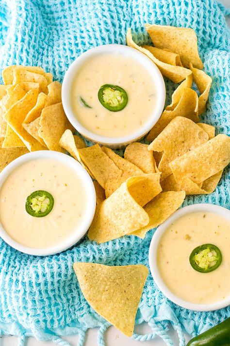 Slow Cooker Queso Blanco (aka white queso dip) is made with just four ingredients and no Velveeta! Restaurant quality made in just minutes in the crockpot. | www.persnicketyplates.com Queso Recipe Easy, Homemade Queso Recipe, Cheesy Queso Dip, Slow Cooker Queso, Mexican White Cheese Dip, Mexican White Cheese, Crock Pot Queso, Queso Blanco Dip, Pepperjack Cheese