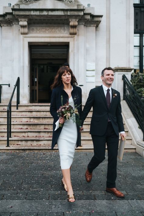 City Chic London Town Hall Winter Wedding – Miss Gen Photography 27  A chic December wedding at the Islington Town Hall with the couple in a contemporary knee-length dress, chic winter coat & swanky Armani suit to match.  #chic #December #wedding #Islington #contemporary #kneelength #dress #wintercoat #swanky #Armani #suit Town Hall Wedding Dress, Townhall Wedding Dress, Couple In Winter, Beaded Sheath Wedding Dress, Alternative Weddings, London Couple, Chic Winter Coat, Armani Suit, Making A Wedding Dress