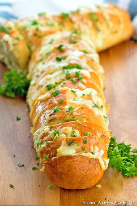 This Cheesy Garlic Bread turns an inexpensive loaf of bread into a gooey million dollar treat #garlicbread #cheesygarlicbread #breadrecipes #easyrecipes #cheese #cheesebread #Italianbread #breadrecipes #sidedishrecipes #dinner #dinnerideas #southernfood #southernrecipes Melissas Southern Style Kitchen, Cheesy Garlic Bread Recipe, French Bread Loaf, Homemade Garlic Bread, Savory Cheese, Herb Bread, Homemade Bread Recipes, Garlic Bread Recipe, Cheesy Garlic Bread