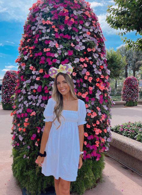 Ears: @soarinovermaintstreetco linked similar 🤍 Disney Aesthetic Instagram Outfit Photo Ideas #LTKdisney #disneyoutfit #disneyshirt #disneyoutfitideas #disneystyle #minimaldisneystyle #disney #wdw #waltdisneyworld #disneyaesthetic #themeparkoutfit #comfyoutfit #disneyears #disneyphotoideas #disneyaesthetic #disneystyle #LTKdisneyoutfit minimal Disney style outfit ideas, Epcot flower and garden outfit, white babydoll dress, floral Disney ears, golden goose outfit, golden goose superstar sneake Epcot Flower And Garden Festival Outfit, Flower Garden Outfit, Disney Aesthetic Outfit, Outfit Photo Ideas, Epcot Outfit Ideas, Disneyland Fits, Epcot Outfit, Disney Parks Outfits, Garden Outfit