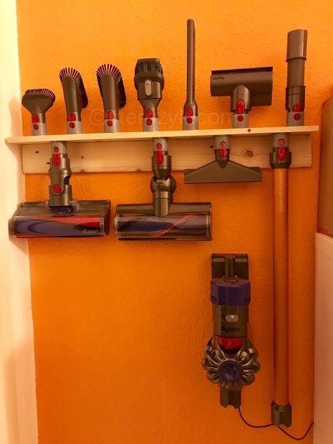 Wall Mounted Vacuum Storage, Dyson Attachment Storage, Hanging Vacuum On Wall, Dyson Vacuum Wall Mount Ideas, Dyson Wall Mount Ideas, Rangement Dyson, Dyson Organization, Dyson Storage Ideas, Dyson Vacuum Storage