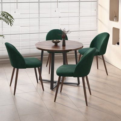 Designed for those who cherish space, our set redefines functionality. Ingeniously crafted chairs elegantly nest beneath the table, a dance of form and space that transforms any setting into a spacious haven for conversations. Ideal for small families! Chair Color: Green | George Oliver Jazabella Round 35.4" Dining Set Wood / Upholstered / Metal in Brown | 29.5 H x 35.4 W x 35.4 D in | Wayfair Small Round Dining Table, Small Dining Sets, Round Wooden Dining Table, Glass Dining Table Set, Wooden Dining Table Set, Small Dining Room Table, Breakfast Nook Dining Set, Nook Dining Set, Round Table And Chairs