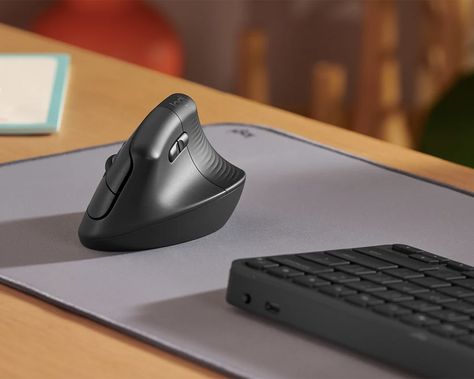 The vertical mouse is an innovative design that brands like Razer, Hyper X, and Corsair have yet to crack. Logitech, however, is proud to announce the Lift, a vertical mouse that maximizes versatility and functionality while still keeping ergonomics front and center. The mouse is smaller than other Logitech models, with a 57-degree incline that Campervan Life, Game Change, Raise Your Hand, Ergonomic Mouse, Nebraska Furniture Mart, Logitech, Left Handed, Gaming Mouse, Wireless Charger