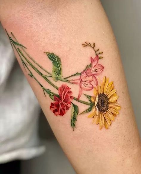 The Meanings Of Carnation Tattoos (Explained In Detail) Carnation And Marigold Tattoo, Carnation Tattoos, Carnation Flower Tattoo, Marigold Tattoo, Carnation Tattoo, Flower Tat, Daffodil Tattoo, Tulip Tattoo, Matching Sister Tattoos