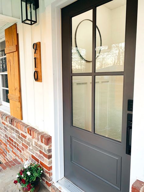 Front Door Iron Ore Sherwin Williams, Night Owl Sherwin Williams Front Door, Iron Oar Sherwin Williams Front Door, Dark Exterior Door, Ranch Style Home Front Door, Back Door Garden Ideas, Sw Iron Ore Exterior Front Doors, Peppercorn Front Door Sherwin Williams, Dark Charcoal Front Door