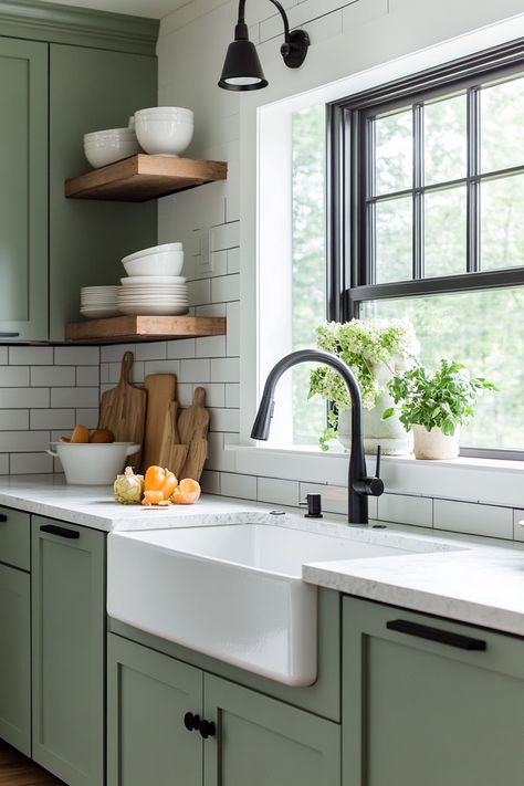 Discover the latest kitchen design trend with this modern farmhouse look! Featuring stylish green cabinetry, open shelving, and a deep farmhouse sink, this space combines functionality and elegance. Perfect for any home makeover! #kitchendesign #farmhousechic #homedecor Green Cabinetry Kitchen, Green Farmhouse Cabinets, Farmhouse Sink Green Cabinets, Green Kitchen Butcher Block, Farmhouse Kitchen Green Cabinets, Green Farm Kitchen, Deep Green Kitchen, Farmhouse Kitchen Green, Green Cottage Kitchen