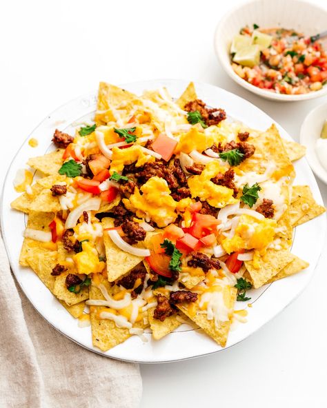 Soft Scrambled Eggs and Spicy Chorizo Breakfast Nachos · i am a food blog i am a food blog Breakfast Nachos, Cheesy Nachos, Chorizo Breakfast, Cilantro Salsa, Glazed Meatballs, Chorizo Recipes, Nachos Recipe, Spicy Pork, Scrambled Eggs