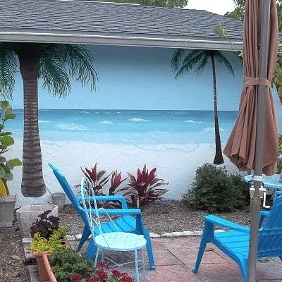 Patio faces a garage wall painted, planted to look like the beach w palm trees. What a relaxing improvement! Backyard Murals, Beach Murals, Murals Outdoor, Painted Fences, Garden Murals, Fence Murals, Fence Painting, Beach Wall Murals, Beach Mural