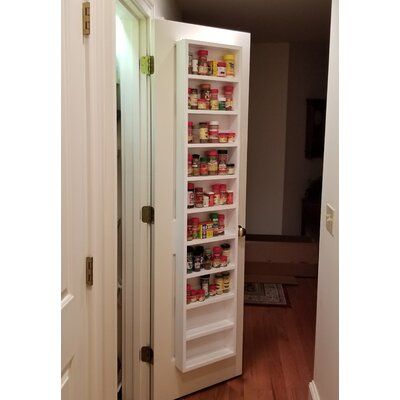 Can be mounted on the wall, side of a cabinet, or on a door All fasteners are included regardless of where you plan to mount it Timber Tree Cabinets Size: 69" H x 11" W x 4.5" D, Color: White Enamel | Timber Tree Cabinets Mitchell On the Wall Spice Rack 69.0 H x 11.0 W x 4.5 D in white in White Enamel | 69" H x 11" W x 4.5" D | Wayfair Back Of Door Spice Rack, Narrow Spice Cabinet, Spice Rack Between Studs, Pantry Door Spice Rack, Craftsman Stairs, Pantry Door Storage, Door Spice Rack, Wall Spice Rack, Spice Shelf