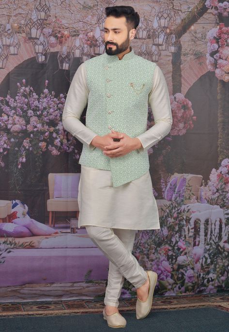 Readymade Art Silk Kurta in Off White This Collar Neck and Full Sleeve attire is Allured with Buttons and Thread Work Available with an Off White Art Silk Aligarhi Pant and a Sea Green Satin Asymmetric Nehru Jacket Do note: Footwear shown in the image is for presentation purposes only. Half to one inch may vary in measurement. (Slight variation in actual color vs. image is possible) Gents Engagement Dress, Kurta Pant Jacket For Men, Bandi Jacket Men With Kurta, Mens Kurta Jacket Designs, Kurta Pajama With Nehru Jacket Wedding, Bundy Kurta Set For Men, Groom Attire For Engagement, Engagement Kurta For Groom, Sea Green Shirt Outfit Men