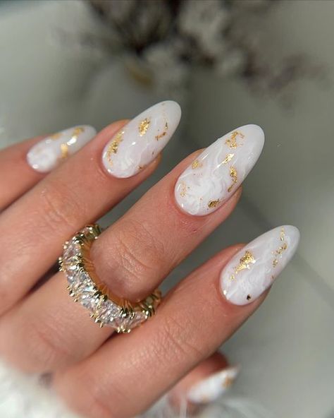 LN Nailed It on Instagram: "Just obsessed with this one !  ALL PRODUCTS FROM LNNAILEDIT.COM - RUBBER BASE (tba)  - ALMOND LONG soft gel (tba) - DETAIL BRUSH - NO WIPE TOP marble inspo @heygreatnails #nails #nailstyle #nailsdesign #nailslove #nailsalon #nailsmagazine #nailsonpoint #nailsoftheweek #nailporn #gelnail #nailsnailsnails #nailartlove #naildesigns #nailsdid #nailpro #naillove #acrylicnails #nailsonfleek #instanail #beautynails #nailselfie #naildesign #nailstagram #nailsofinstagram #nailsart #instanails #gelnails #nailsoftheday #nail #nailart" White And Gold Nails Simple Almond, Milky White Almond Nails With Gold, Almond Gold Foil Nails, Gold Detail Nails Almond, White Nail Gold Foil, August Nails, Popular Nail Designs, Witch Nails, Simple Fall Nails