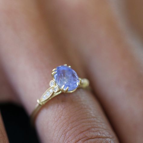 Perfect for a lady who likes her (jewellery) history and appreciates fine jewellery design. This exquisitely hand crafted engagement ring gives a strong wink to the delicate designs of the Edwardian era and is perfect for contemporary tastes in minimalist design.For this ring we've used a reclaimed Ceylon sapphire, because it was just too good to pass up. It's a vibrant 1.86 carats of natural, unheated sapphire in a beautiful cornflower blue, so typical of its origin. The yellow gold lends the r Ceylon Sapphire Ring, The Edwardian Era, Blue Sapphire Engagement Ring, Blue Engagement Ring, Ceylon Sapphire, Simple Engagement Rings, Sapphire Engagement Ring Blue, Sapphire Engagement Ring, Wedding Ring Designs