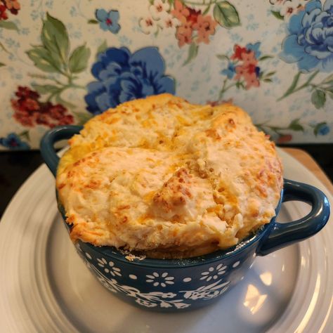 Personal size chicken and biscuit: In a pot on the stove, combine: Chopped Rotisserie chicken or one cooked chicken breast that is chopped 1 cup chicken broth 1 can cream of chicken soup Onion and garlic powder to taste Shredded triple cheddar cheese to taste Any other spices you would like Warm completely until slightly bubbly. Fill each dish 3/4 full with mixture. In a bowl make a box of cheddar bay biscuit mix. Add biscuit mix to top of dishes. Place on a baking tray and cook about 2... Cheddar Bay Biscuit Topped Soup, Chicken Soup With Biscuits, Chicken And Dumpling Soup With Cheddar Bay Biscuits, Chicken Soup With Cheddar Bay Biscuits, Cracked Chicken Soup With Cheddar Bay Biscuit Topping, Chicken Pot Pie Bake With Cheddar Bay Biscuits, Rotisserie Chicken Soup, Cheddar Bay Biscuits, Cheddar Biscuits